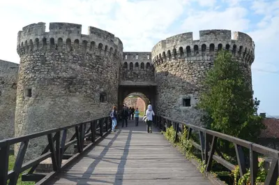 a bridge over the moat of a castle at Bardolino Apartment in Belgrade