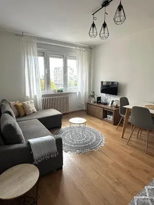 a living room with a couch and a table at Bardolino Apartment in Belgrade