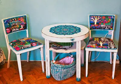 a table with two chairs and a table with a table and two chairs at Apartment Dorcol in Belgrade