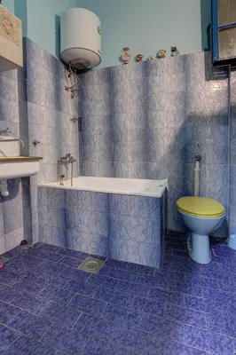 a bathroom with a tub and a toilet and a sink at Apartment Dorcol in Belgrade