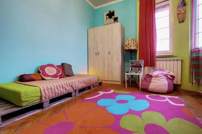 a bedroom with a bed and a rug at Apartment Dorcol in Belgrade