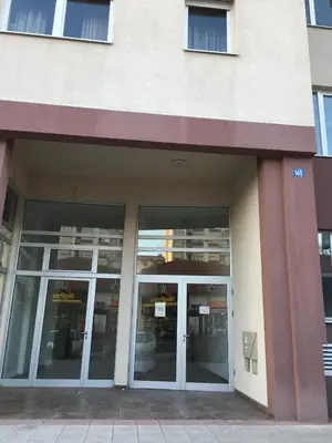 an empty building with glass doors in front at Stardust Belgrade in Belgrade