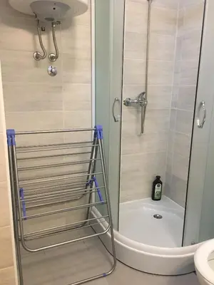 a shower with a glass door in a bathroom at Stardust Belgrade in Belgrade