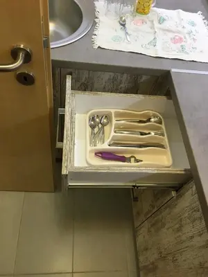 a drawer in a counter with some tools in it at Stardust Belgrade in Belgrade
