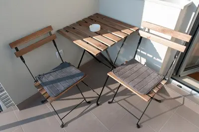 two chairs and a table and a table and chair at Apartment Ada in Belgrade