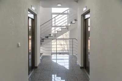 a hallway with a spiral staircase in a building at Apartment Ada in Belgrade