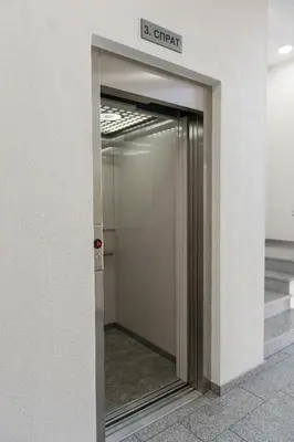 an elevator door in a building with a sign on it at Apartment Ada in Belgrade