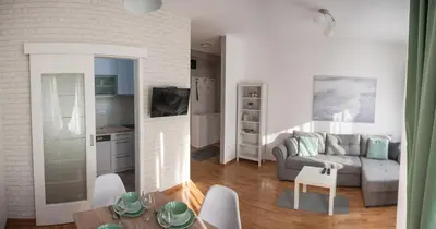 a living room with a couch and a table at Apartment Ada in Belgrade