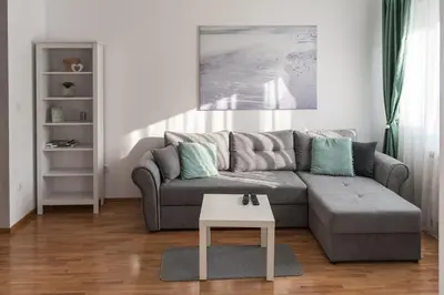 a living room with a couch and a table at Apartment Ada in Belgrade