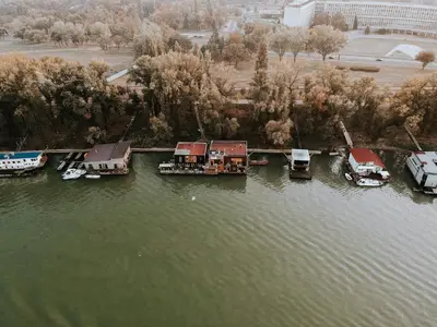 an aerial view of a harbor with boats in the water at ArkaBarka Floating Hostel in Belgrade