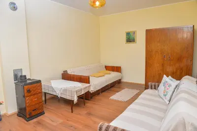 a living room with a bed and a couch at etno dom 