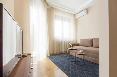 a living room with a couch and a table at Prime Hotel Apartmani in Belgrade