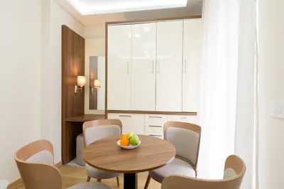 a dining room with a table and chairs at Prime Hotel Apartmani in Belgrade