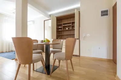 a dining room with a table and chairs at Prime Hotel Apartmani in Belgrade