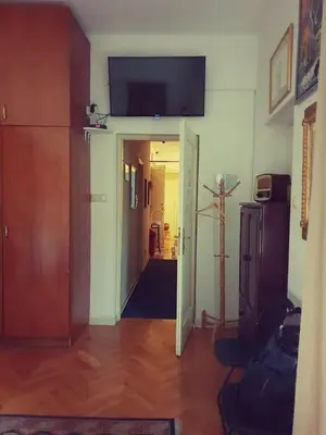 a living room with a television on the wall at Sun Hostel in Belgrade