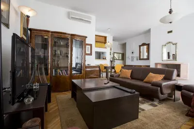 a living room with a couch and a coffee table at Sun Hostel in Belgrade