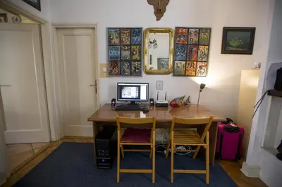 a home office with a desk with a computer on it at Sun Hostel in Belgrade