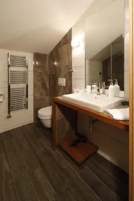 a bathroom with a sink and a toilet at Hotel Passpartù Home Garni in Belgrade