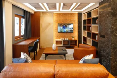 a living room with a couch and a table at Hotel Passpartù Home Garni in Belgrade