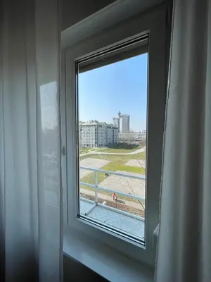 a window with a view of a city at Booky Apartment in Belgrade
