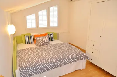 a bedroom with a bed with pillows on it at Apartment ON TOP 23 in Belgrade