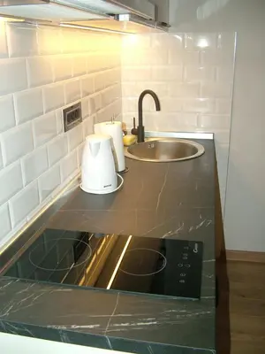 a kitchen with a sink and a counter top at Rose Lux in Belgrade