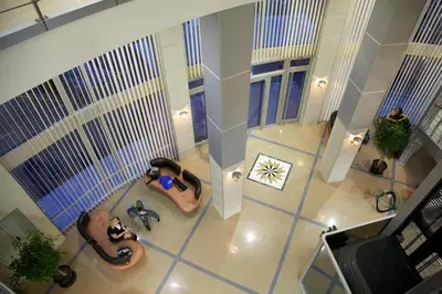 an overhead view of two people taking a picture in a building at Hotel Zeder Garni in Belgrade