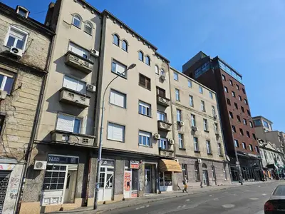 a tall building on a city street with at Matea apartman in Belgrade