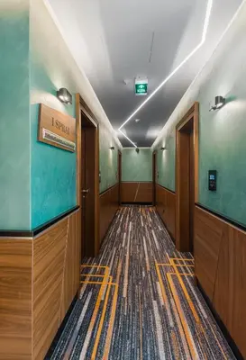 a corridor of an office building with a hallway at Sky Hotel in Belgrade