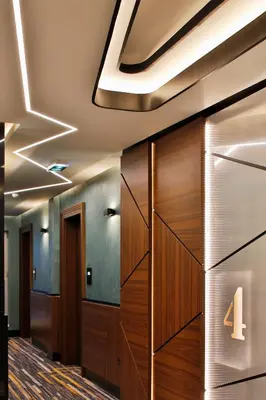 a lobby with a door with the number four on it at Sky Hotel in Belgrade