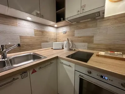 a kitchen with a sink and a counter top at Cherrycity apartments in Belgrade
