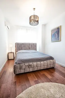 a bedroom with a large bed in a room at A Blok-Apartment The One in Belgrade