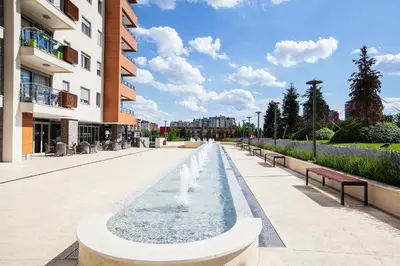 a water fountain in the middle of a street at A Blok-Apartment The One in Belgrade
