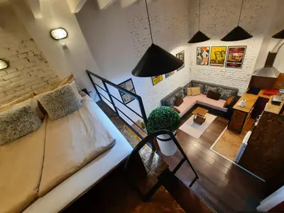 an overhead view of a living room with a couch at Authentic Belgrade Centre - Split Level loft with Patio in Courtyard in Belgrade