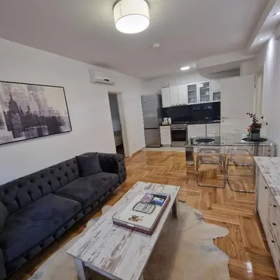 a living room with a couch and a table at M48 apartments in Belgrade