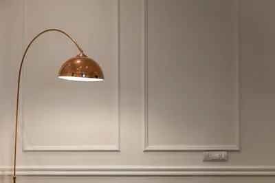 a lamp next to a white door at Max Central Apartment in Belgrade