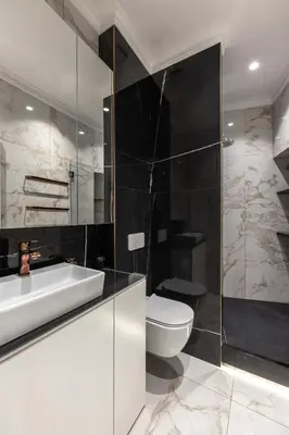 a bathroom with a white sink and a toilet at Max Central Apartment in Belgrade