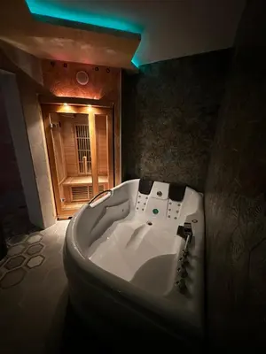 a bathroom with a white tub in a room at Vila Argola - Spa Luxury Apartments in Belgrade
