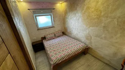 a small room with a bench with a window at Vila Argola - Spa Luxury Apartments in Belgrade