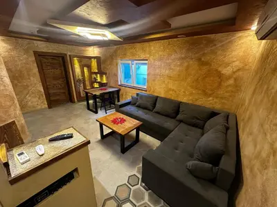 a living room with a couch and a table at Vila Argola - Spa Luxury Apartments in Belgrade