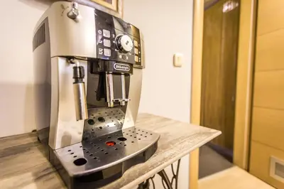a sewing machine sitting on top of a wooden counter at HostGost Selected Suites - BAMS, Private Spa included in Belgrade