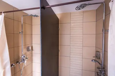 a bathroom with a shower with a glass door at HostGost Selected Suites - BAMS, Private Spa included in Belgrade