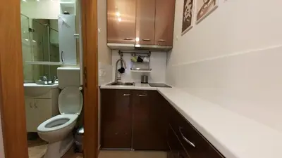 a small bathroom with a toilet and a sink at Apartment OASIS in Belgrade