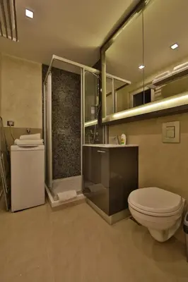 a bathroom with a toilet and a shower at Apartment Piano in Belgrade