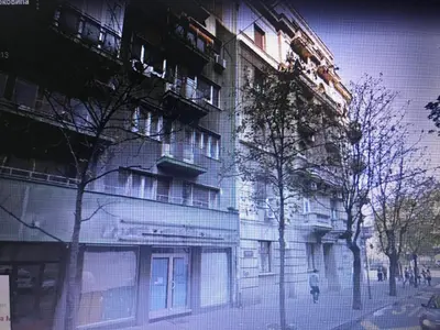 a building on the side of a city street at Apartment Piano in Belgrade