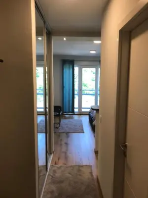 a room with a hallway with a door to a room with a hallwayngthngth at Zaza apartman in Belgrade