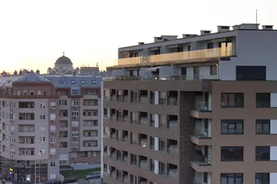 an apartment building with a balcony on top of it at Diva Lux Apartman in Belgrade