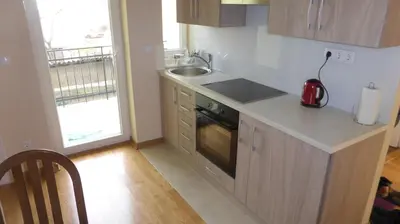 a kitchen with a counter and a sink and a stove at Central and modern in Belgrade