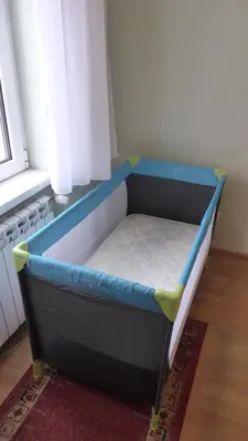 a small bed in a room with a window at Central and modern in Belgrade