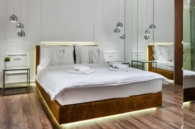 a bedroom with a bed with two towels on it at Room 25 Belgrade in Belgrade